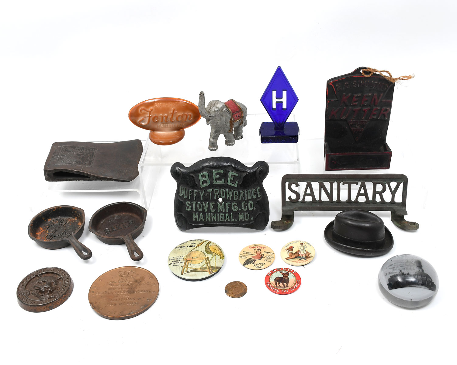 Appraisal: VINTAGE ADVERTISEMENT COLLECTION Comprising Buttons an axe head glass advertisements