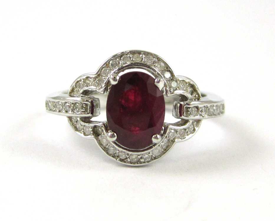 Appraisal: RUBY DIAMOND AND FOURTEEN KARAT GOLD RING with round-cut diamonds