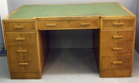 Appraisal: Art Deco oak breakfront pedestal desk of nine drawers on