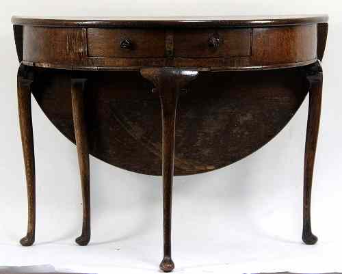 Appraisal: An early th Century Continental oak half-round table with drop