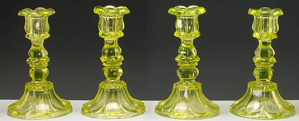 Appraisal: Four blown molded canary glass candlesticks probably Boston amp Sandwich