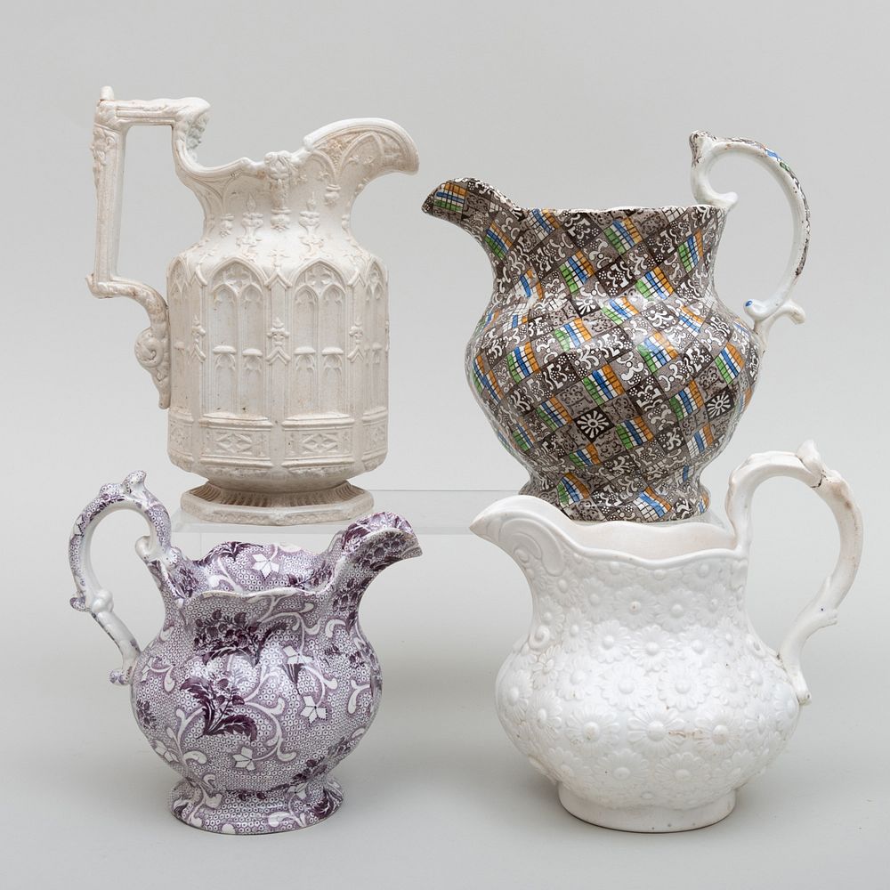 Appraisal: Group of Four English Jugs Comprising A jug molded with