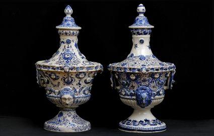 Appraisal: TWO SIMILAR FRENCH FAIENCE BLUE AND WHITE URNS AND COVERS