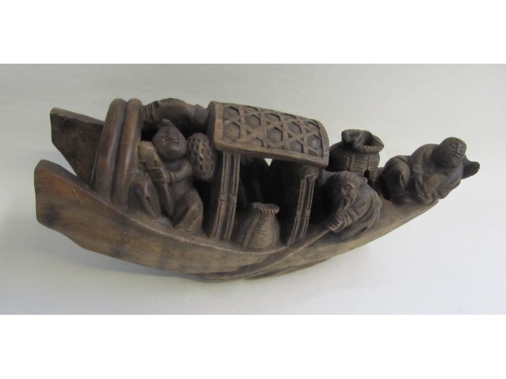 Appraisal: Chinese carved wooden figure of a boat with figures