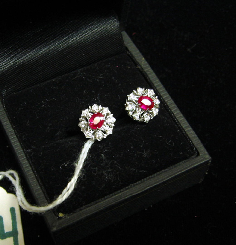 Appraisal: PAIR OF RUBY DIAMOND AND EIGHTEEN KARAT GOLD EARRINGS each