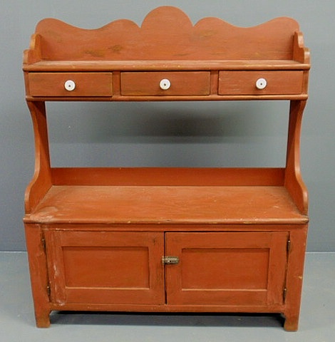 Appraisal: Pennsylvania pine bucket bench c with a scalloped top and