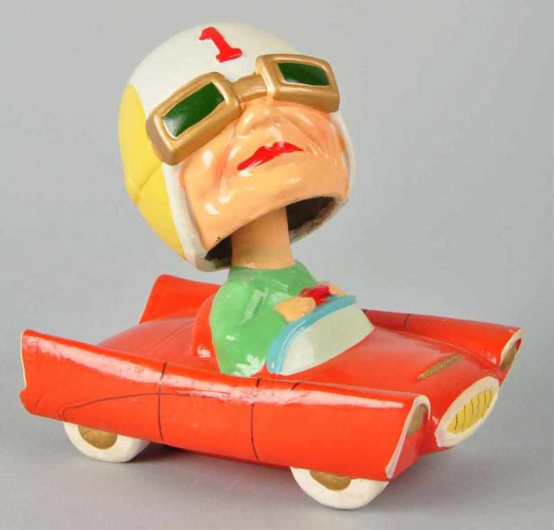 Appraisal: Race Car Driver Bobbing Head Doll Description Marked number on