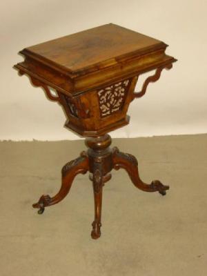 Appraisal: A VICTORIAN WALNUT SEWING TABLE of oblong form hinged lid