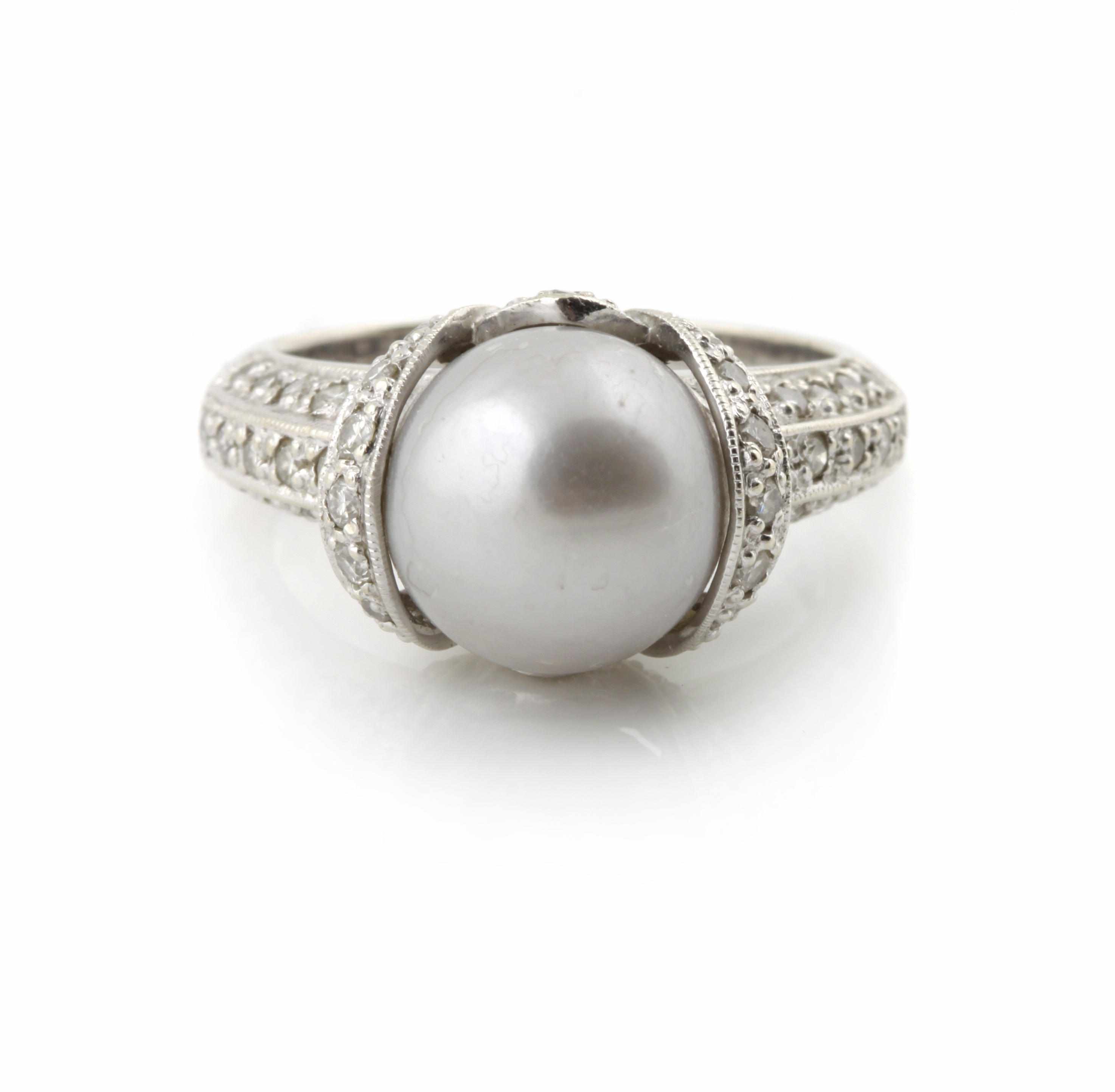 Appraisal: A colored cultured pearl and diamond ring centering a grey-silver