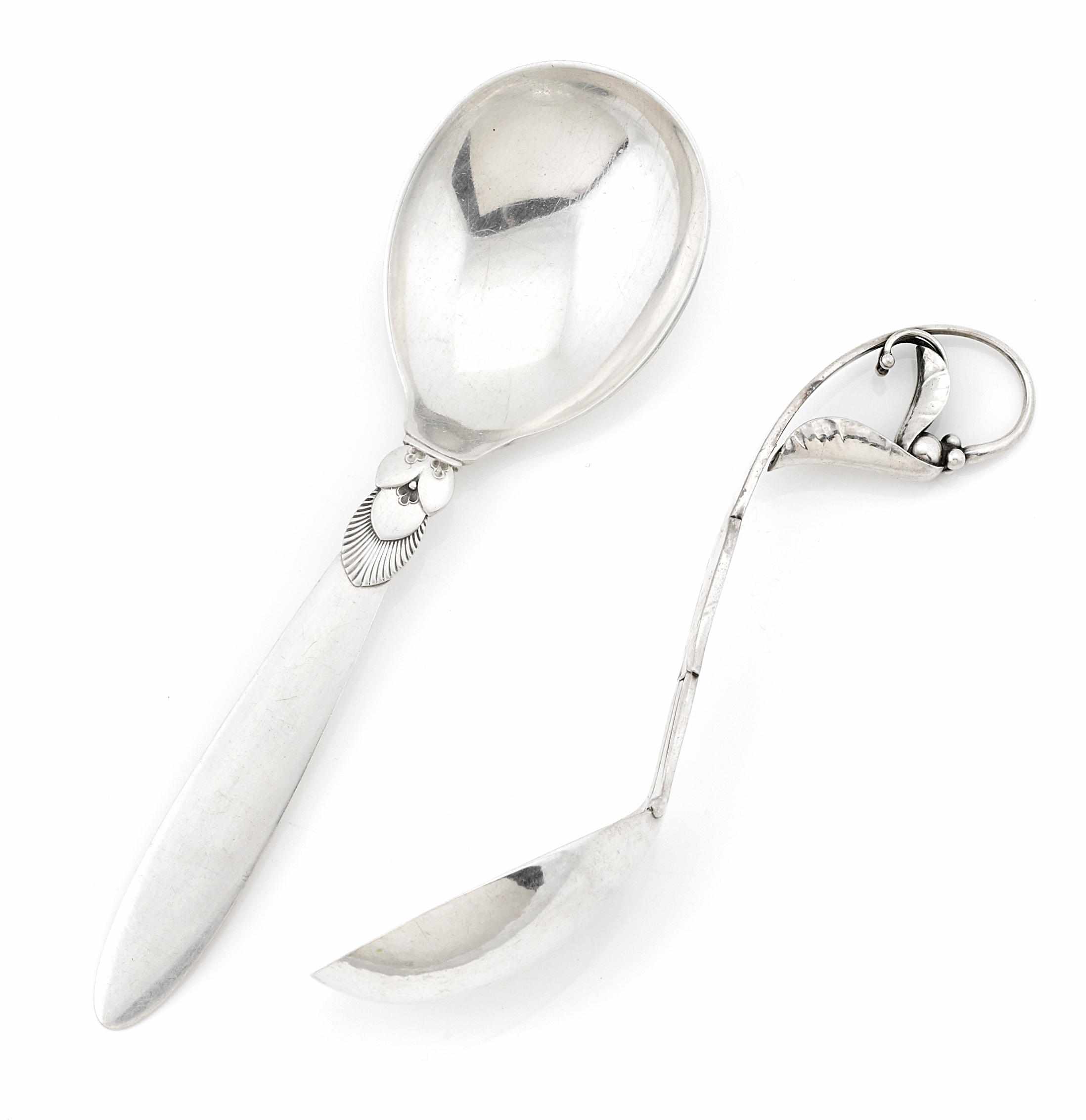 Appraisal: Two Danish sterling silver serving spoons Georg Jensen Copenhagen Circa