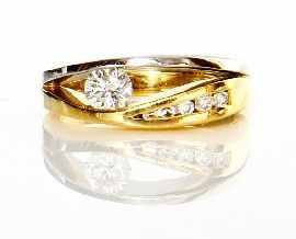 Appraisal: A two-tone ct gold solitaire round brilliant cut diamond ring