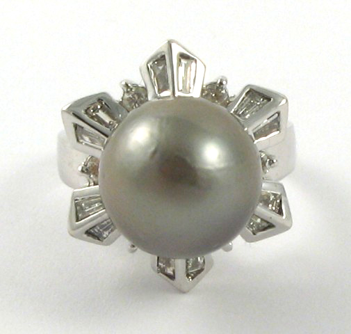 Appraisal: PEARL DIAMOND AND EIGHTEEN KARAT GOLD RING centering a mm