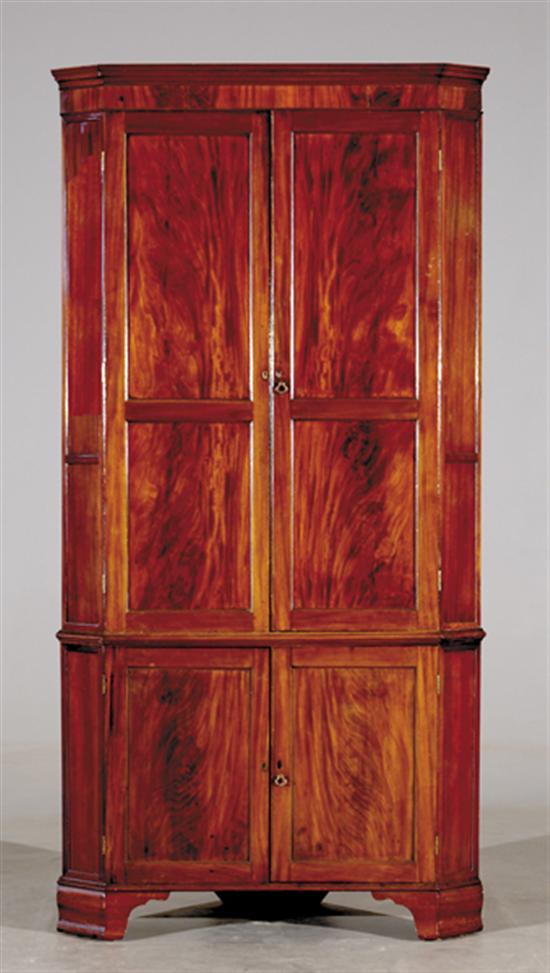 Appraisal: Georgian mahogany corner cupboard circa molded cornice with canted corners