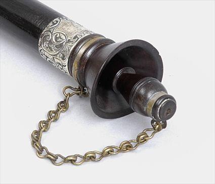 Appraisal: EBONIZED WOOD CANE WITH WHISTLE The ring-turned whistle attached with