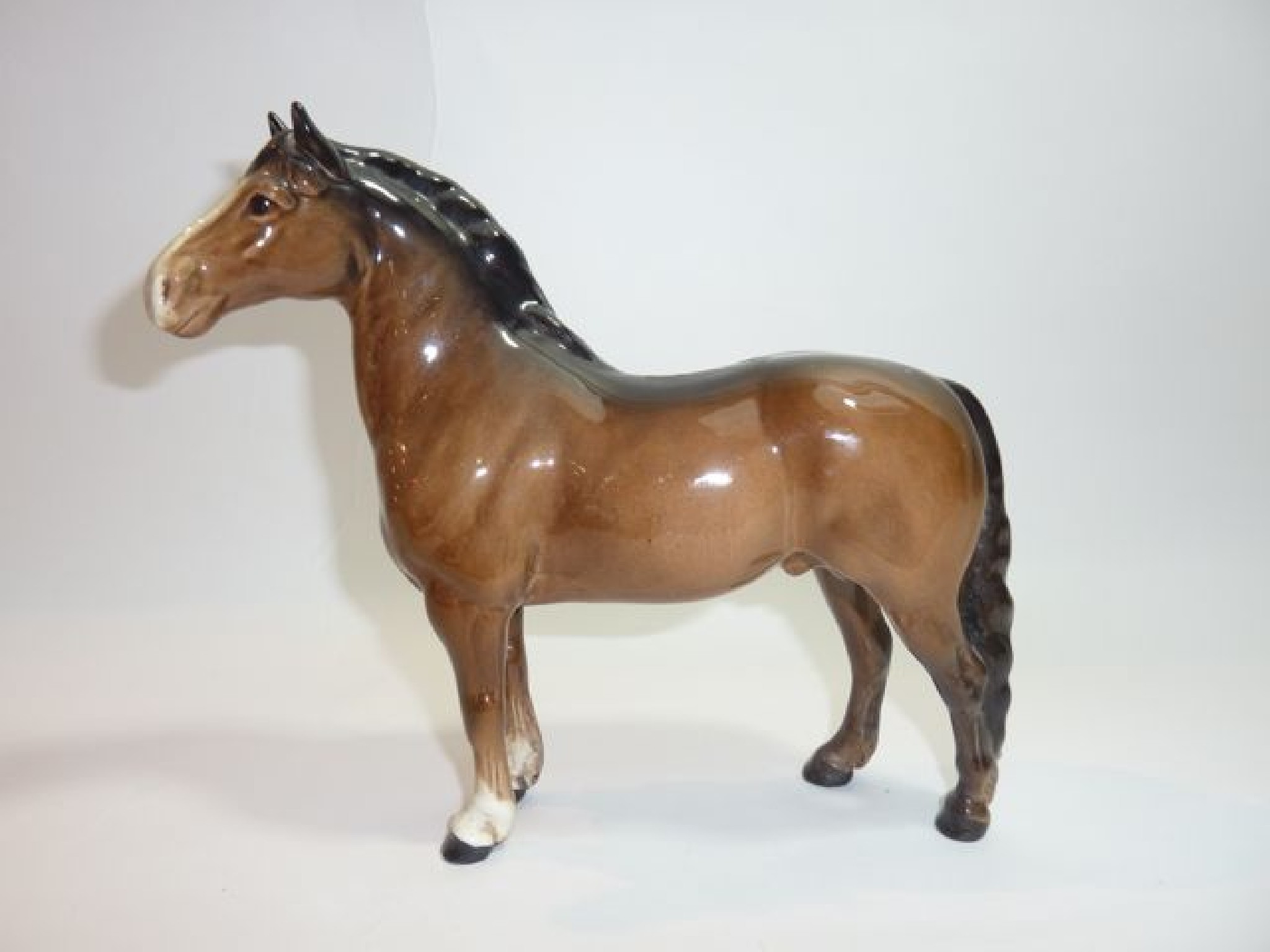 Appraisal: A Beswick model of a brown Welsh cob pony