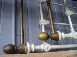 Appraisal: A Victorian brass and white painted iron bed with rails