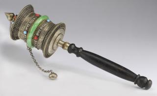 Appraisal: Tibetan Buddhist hand-held prayer wheel having a silver metal head