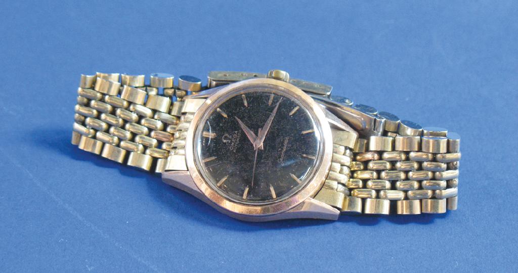 Appraisal: A GENTLEMAN'S GILT METAL OMEGA AUTOMATIC SEAMASTER the black dial