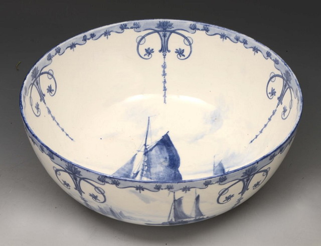 Appraisal: A ROYAL CROWN DERBY BLUE PANELLED CIRCULAR BOWL with fishing