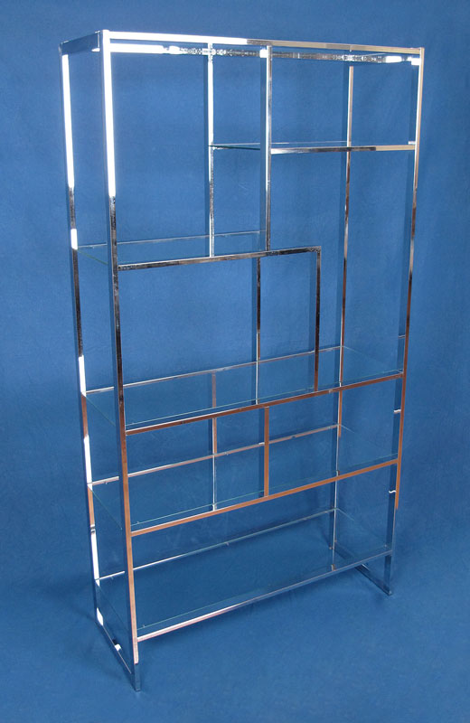 Appraisal: MILO BAUGHMAN CHROME AND GLASS ETAGERE Multi level glass shelves