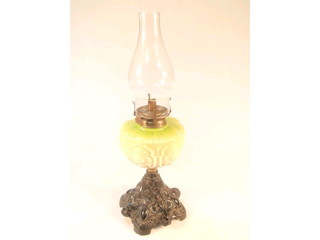 Appraisal: A thC oil lamp with a moulded opaque green glass