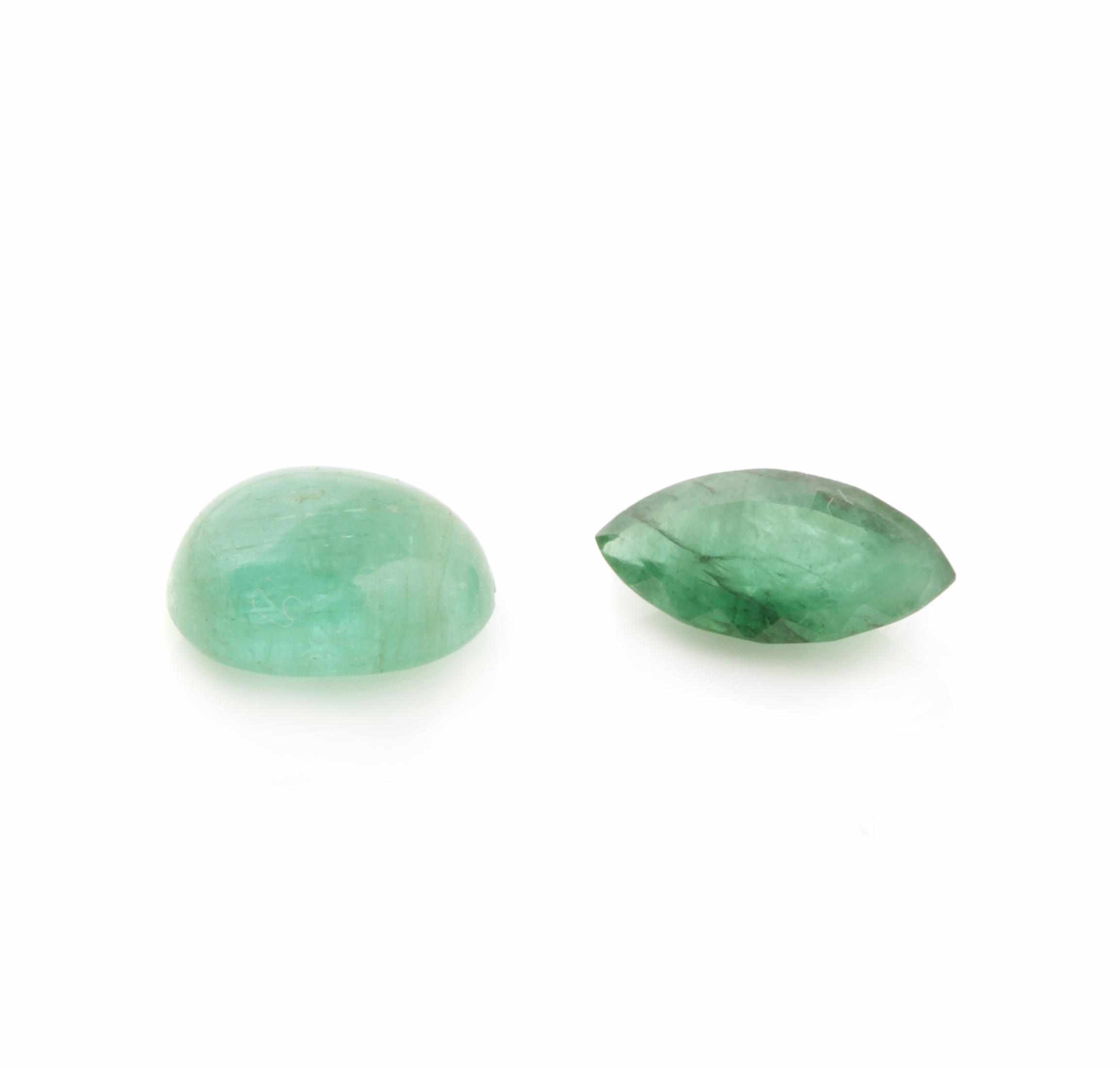 Appraisal: Two Emeralds Including an oval cabochon weighing carats and measuring