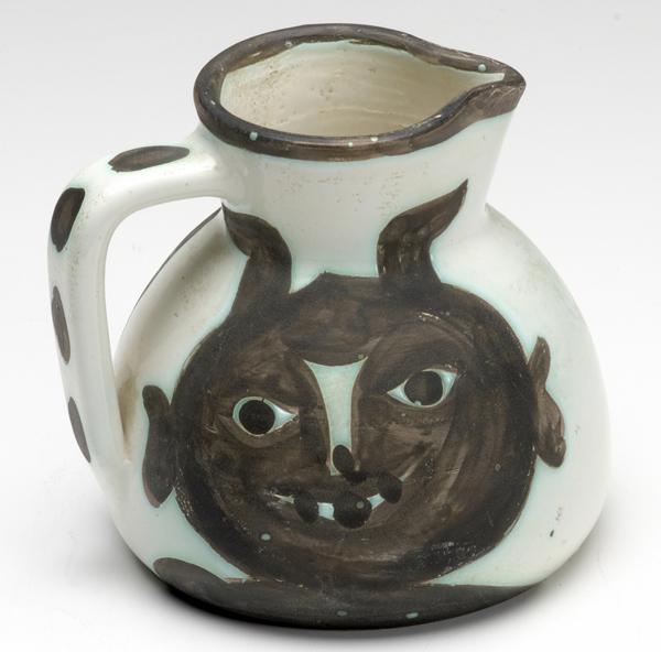 Appraisal: PICASSO MADOURA Glazed earthenware pitcher with abstract mask designs Signed