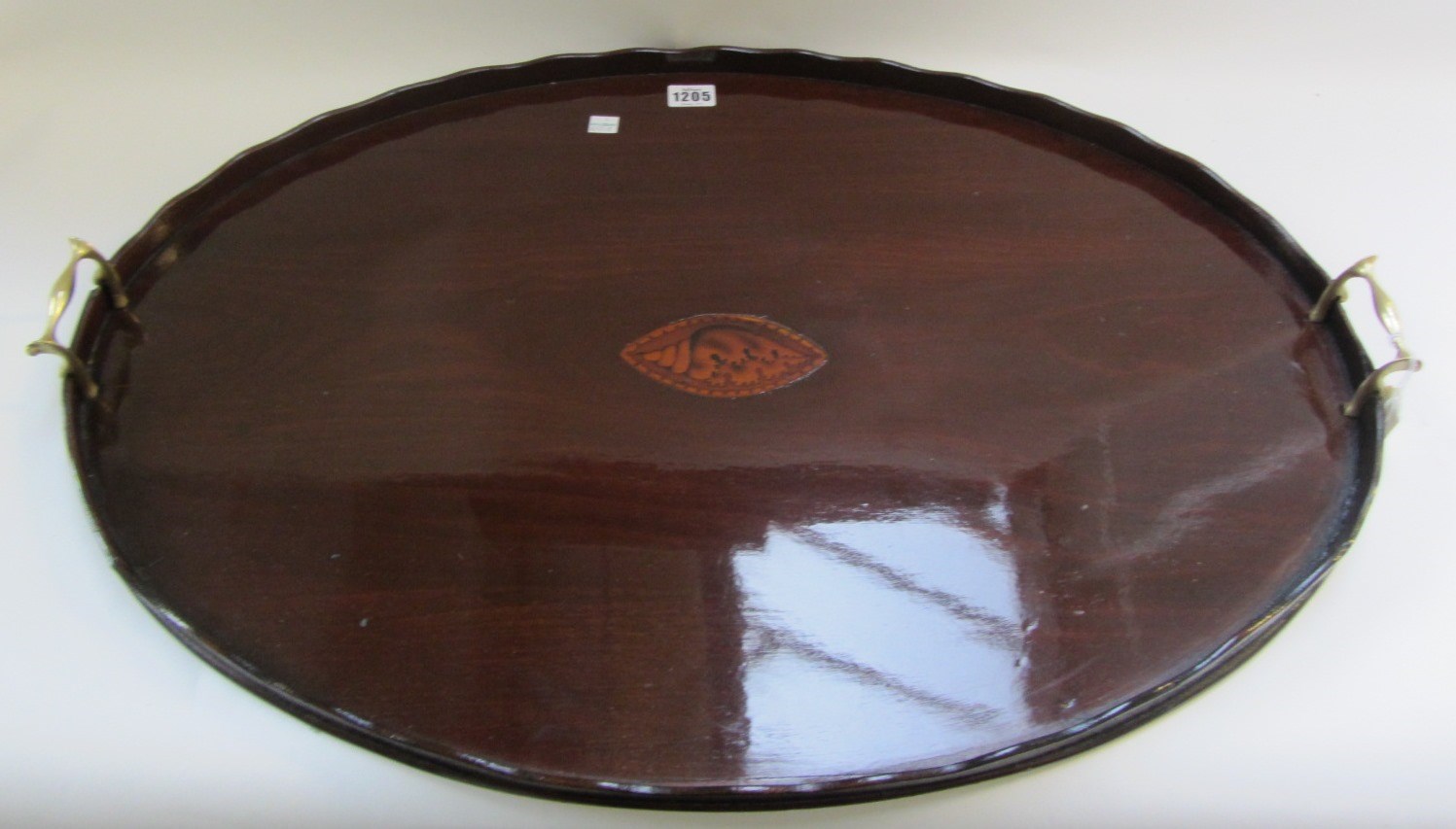 Appraisal: A th century inlaid oval mahogany serving tray cm wide