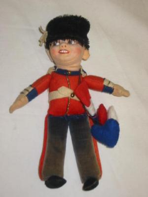 Appraisal: A Norah Wellings coronation guardsman with painted face wearing red