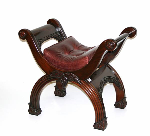 Appraisal: A Neoclassical style mahogany and leather upholstered window seat height