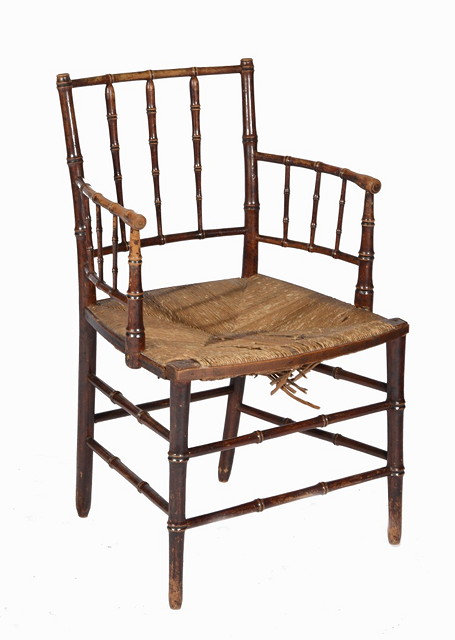 Appraisal: A WILLIAM MORRIS STYLE RUSH SEAT ARMCHAIR with simulated bamboo