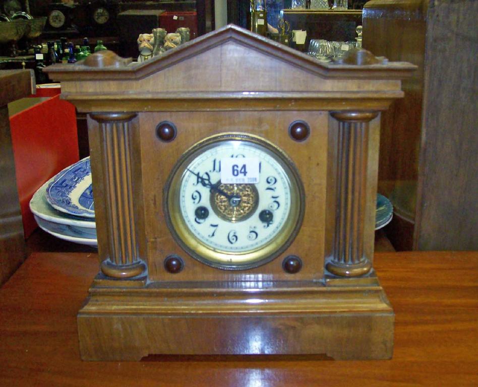 Appraisal: A Victorian walnut cased mantel clock -