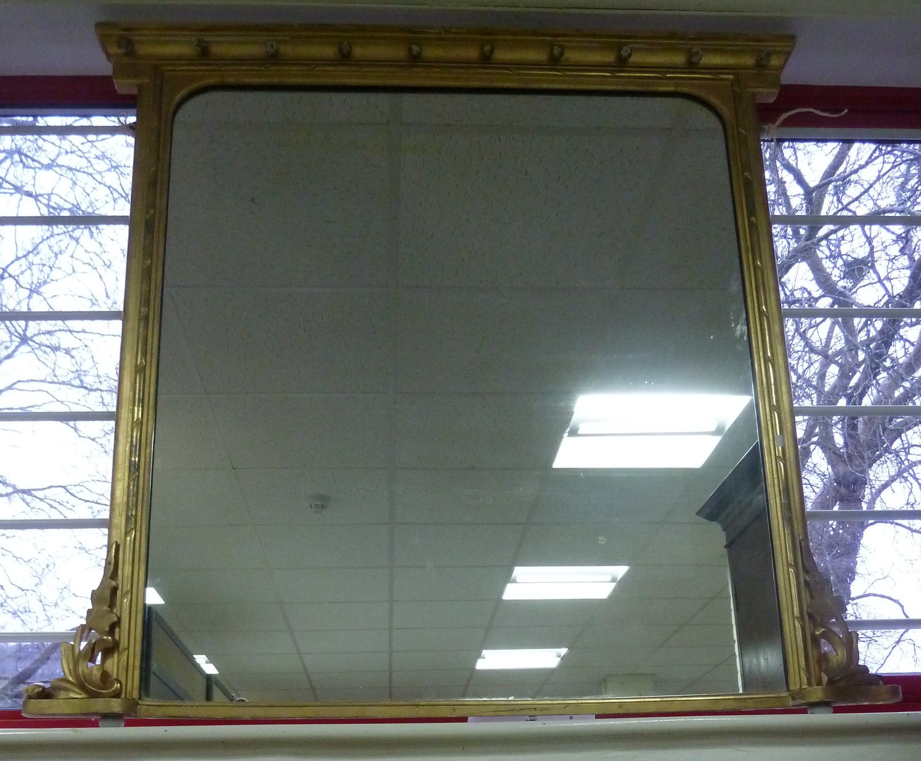 Appraisal: A Regency gilt gesso framed overmantel mirror with applied balls