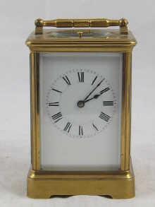 Appraisal: A French brass strike repeat carriage clock striking the hours