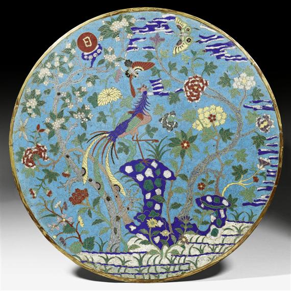 Appraisal: A ROUND CLOISONN PANEL SHOWING A PEACOCK IN A GARDEN