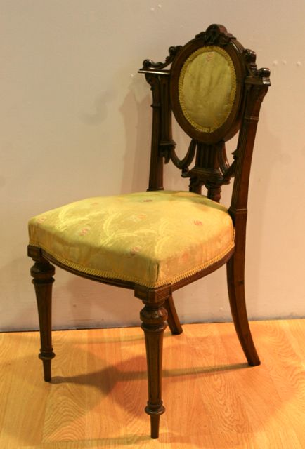 Appraisal: A late Victorian walnut and yellow upholstered salon chair