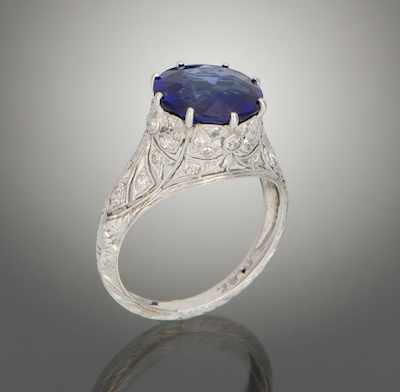 Appraisal: An Edwardian Style Platinum Diamond and Synthetic Sapphire Ring Platinum