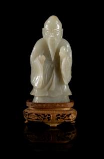 Appraisal: A Near-White Jade Figure of Standing Shoulao LATE MING EARLY