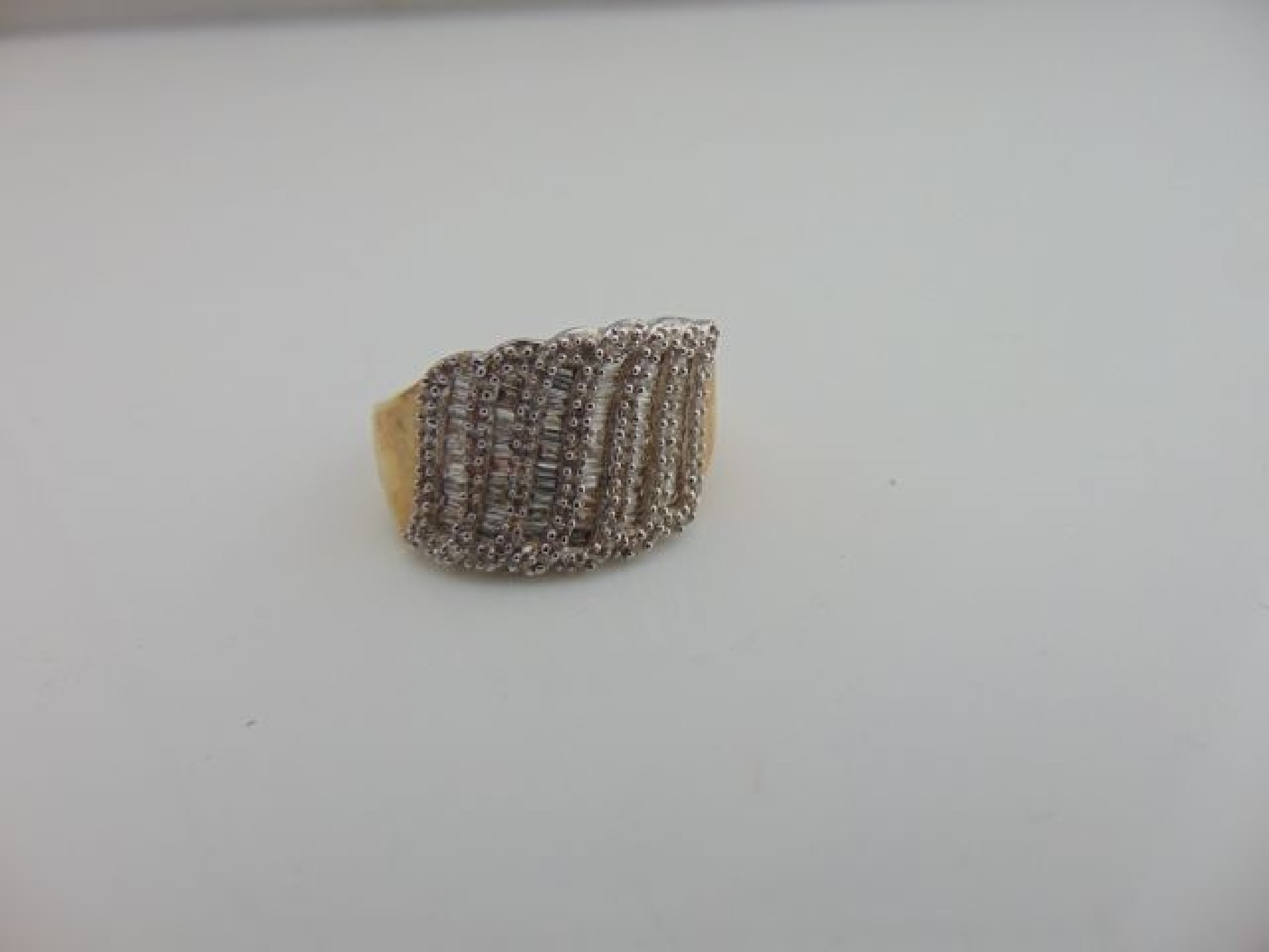 Appraisal: A diamond dress ring channel-set with six rows of tapering