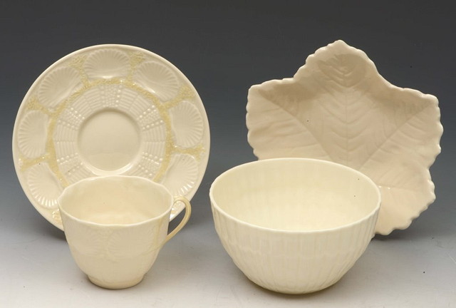 Appraisal: A BELLEEK SHELL PATTERNED CUP AND SAUCER a bowl and