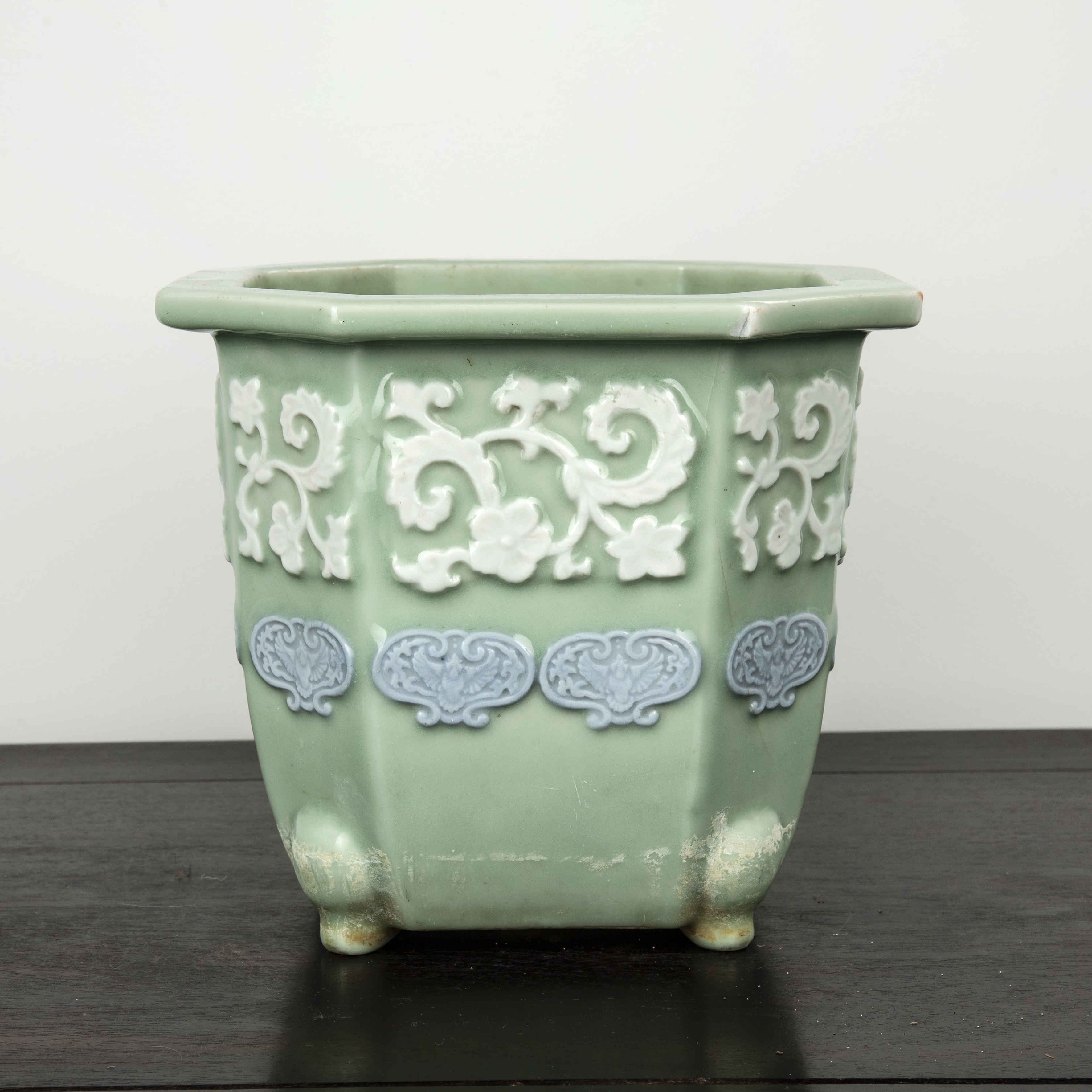 Appraisal: Two celadon jardinieresChinese of octagonal form with ruyi and foliate