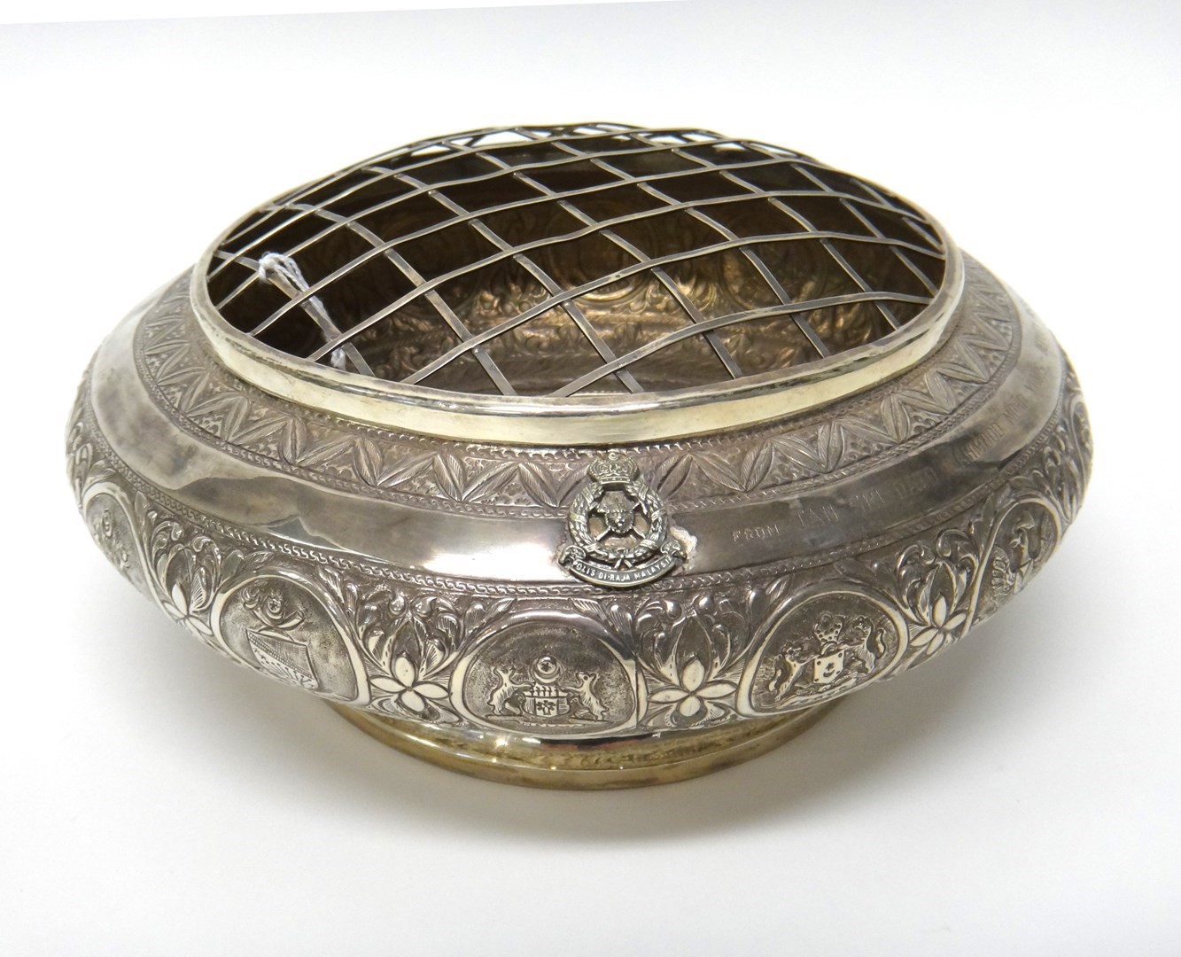 Appraisal: A Malaysian silver rose bowl the shallow compressed bowl chased