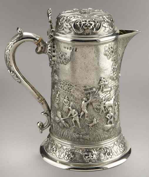 Appraisal: Scottish Victorian silver ale jug with exceptionalrepousse decoration on the