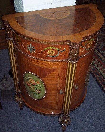 Appraisal: A satinwood painted and decorated half round cupboard of French