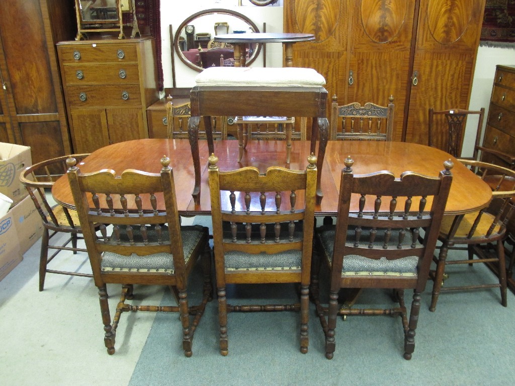 Appraisal: Reproduction mahogany dining table eight assorted chairs piano stool and