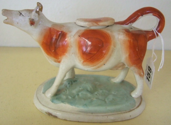 Appraisal: A Pearlware cow creamer th century with red lustre markings