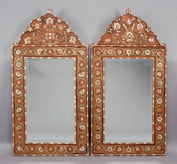 Appraisal: A pair of cut brass shell and bone inlaid mirrors