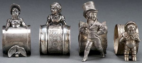 Appraisal: VICTORIAN SILVERPLATE FIGURAL NAPKIN RINGS FOUR VICTORIAN SILVER PLATE FIGURAL