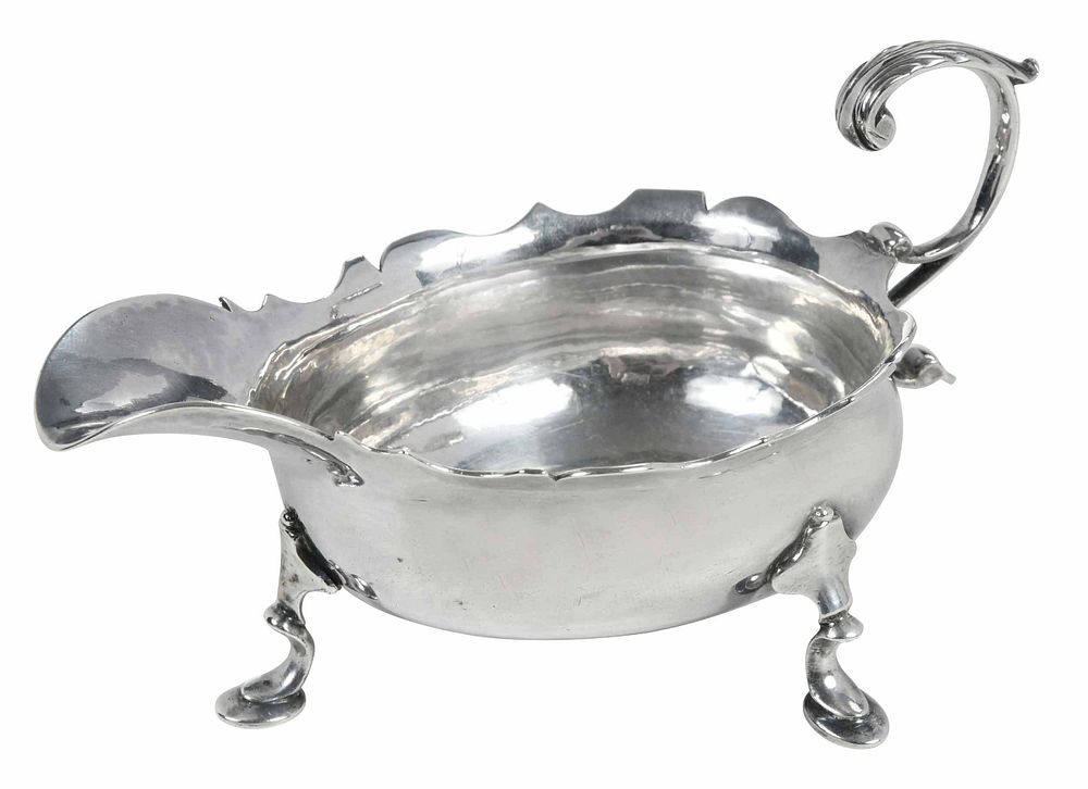 Appraisal: George II English Silver Footed Creamer London oval body scroll