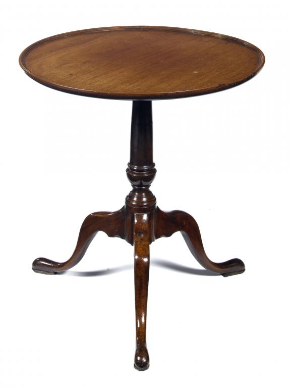 Appraisal: A GEORGE III MAHOGANY TRIPOD TABLE the dished top on